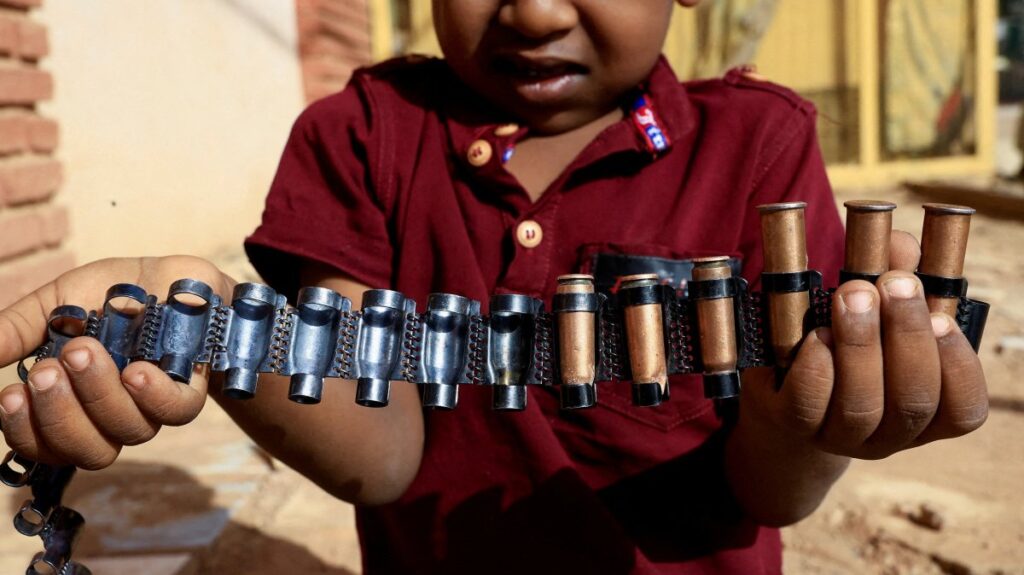 A boy holds bullet cartridges as clashes between Sudan's paramilitary Rapid Support Forces (RSF) and the army continue, in Khartoum North, Sudan, May 13, 2023. (Reuters Photo)