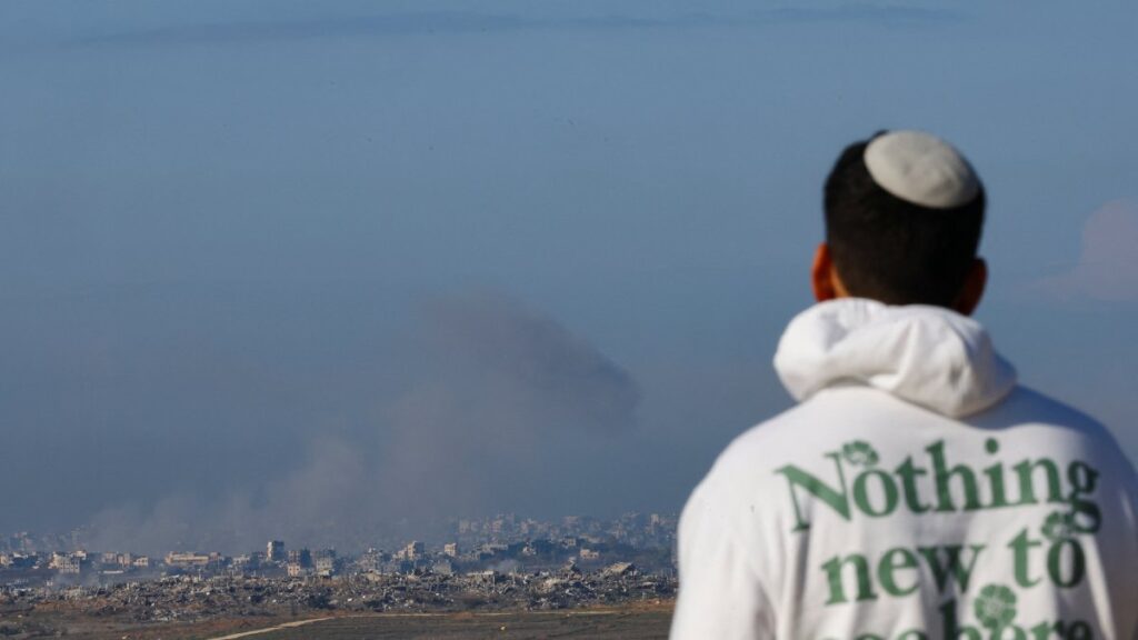 An Israeli person looks in the direction of Israeli military strikes in Gaza, Palestine, Jan. 1, 2025. (Reuters Photo)