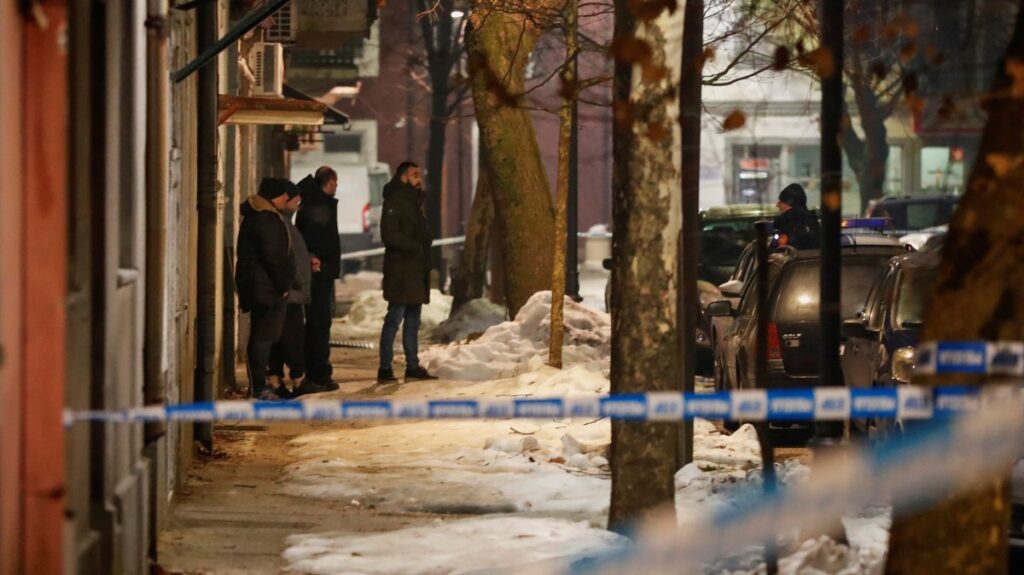 Police and security personnel stand on a street in front of a firetruck near the scene where a gunman opened fire at a restaurant and killed several people, Cetinje, Montenegro, Jan. 1, 2025. (Reuters Photo)