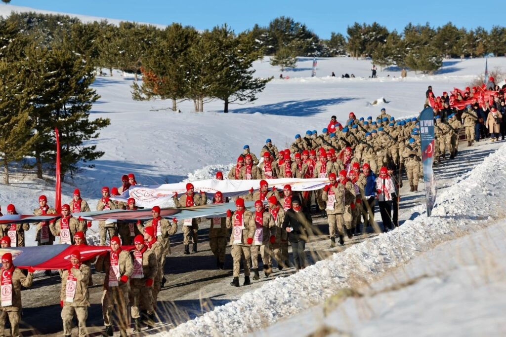 Soldiers march with banners as part of a Ministry of Youth and Sports event organized to remember the thousands of soldiers lost during the World War I Sarıkamış campaign, Türkiye, Jan. 1, 2025. (IHA Photo)