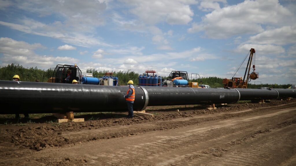 Workers stand near a pipe at a construction site on the extension of Russia's TurkStream gas pipeline, Letnitsa, Bulgaria, June 1, 2020. (Reuters Photo)