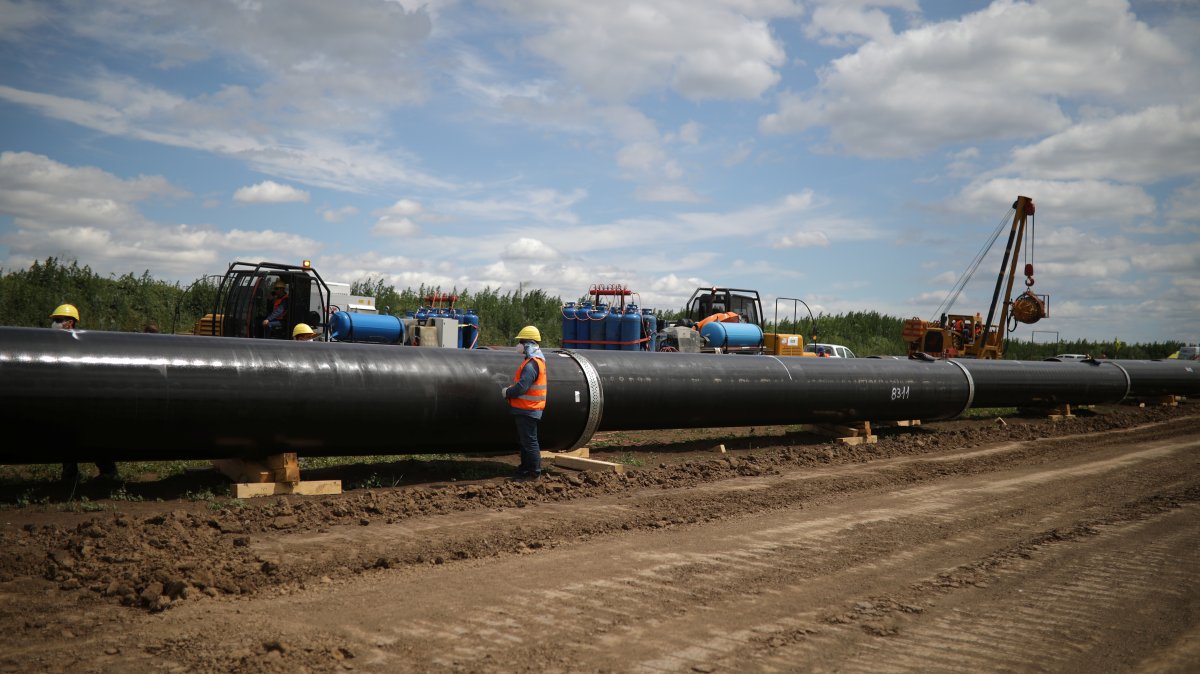 Workers stand near a pipe at a construction site on the extension of Russia's TurkStream gas pipeline, Letnitsa, Bulgaria, June 1, 2020. (Reuters Photo)