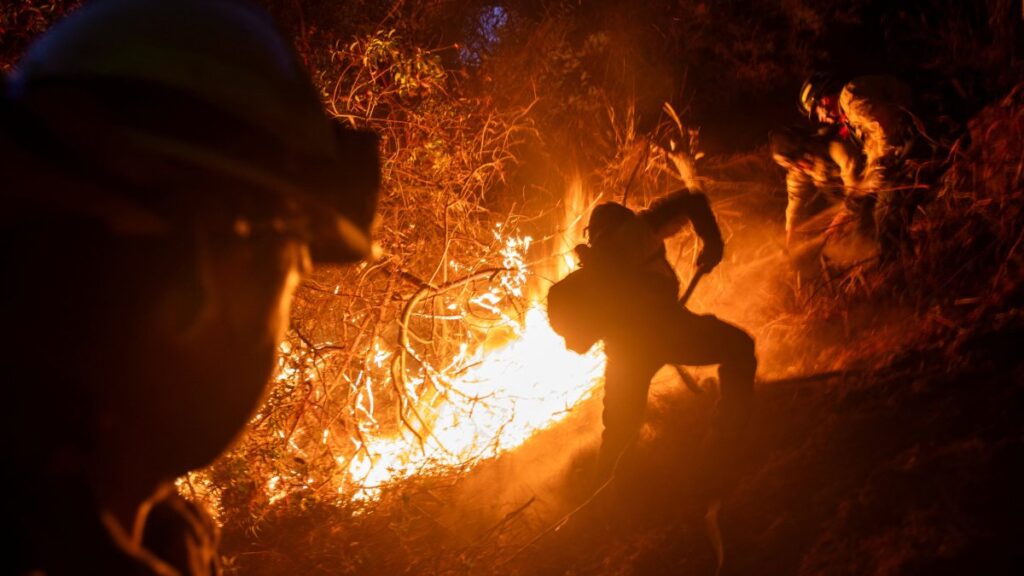 Firefighters extinguish a fire as the Palisades Fire in Los Angeles County, Los Angeles, California, U.S., Jan. 12, 2025. (Reuters Photo)