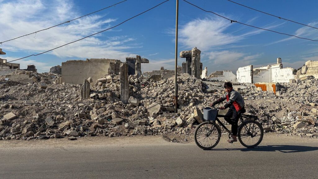 A man rides a bicycle near the completely destroyed al-Asali neighborhood in southern Damascus, Syria, Jan. 9, 2025. (EPA Photo)