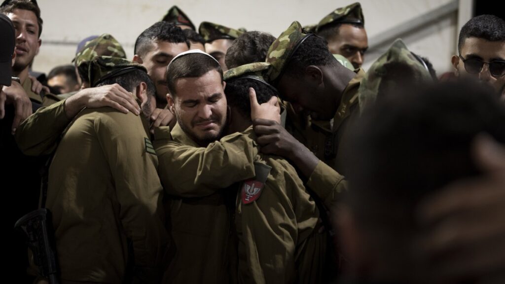 Israeli Defense Forces (IDF) soldiers cry during the funeral of a colleague, in west Jerusalem, Israel, Nov. 20, 2024. (AP Photo)