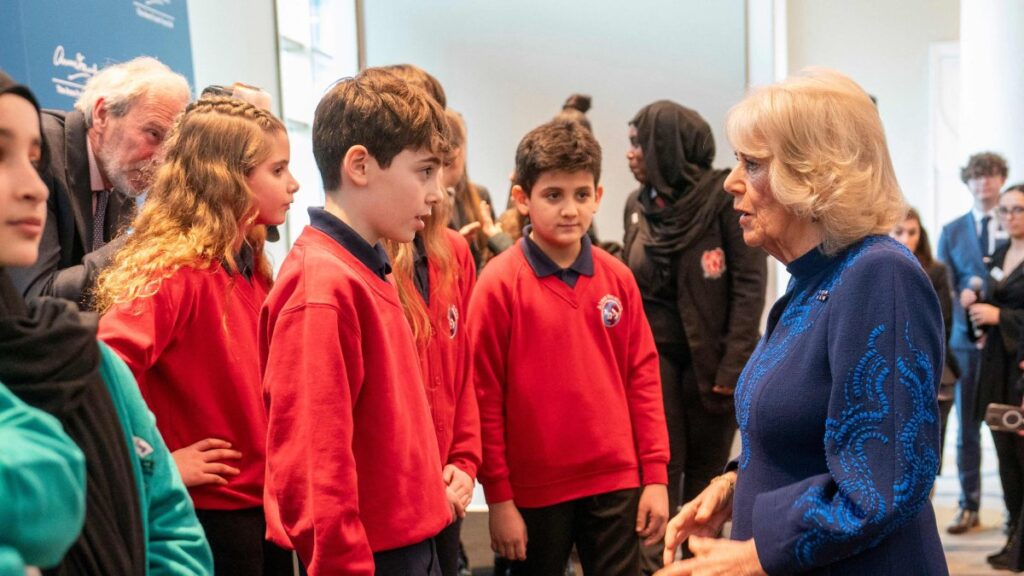Britain's Queen Camilla (R) speaks with school children as she attends a reception, hosted by the Anne Frank Trust to mark Holocaust Memorial Day, Hilton Park Lane, London, U.K., Jan. 23, 2025. (AFP Photo)
