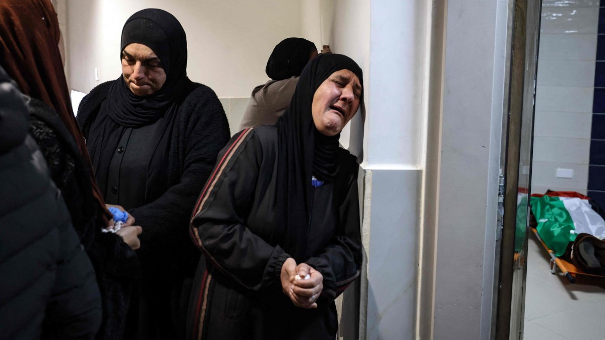 Relatives mourn the death of a Palestinian man killed by Israeli military in Jenin, occupied-West Bank, Palestine, Feb. 2, 2025. (AFP Photo)