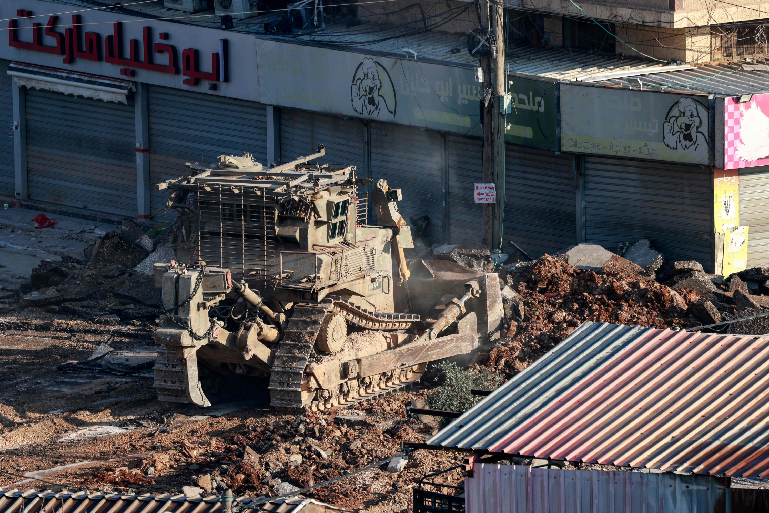 366609 An Israeli military bulldozer digs up a street in the al-Fara camp for Palestinian refugees south of Jenin in the occupied West Bank, Palestine, Feb. 2, 2025. (AFP Photo)