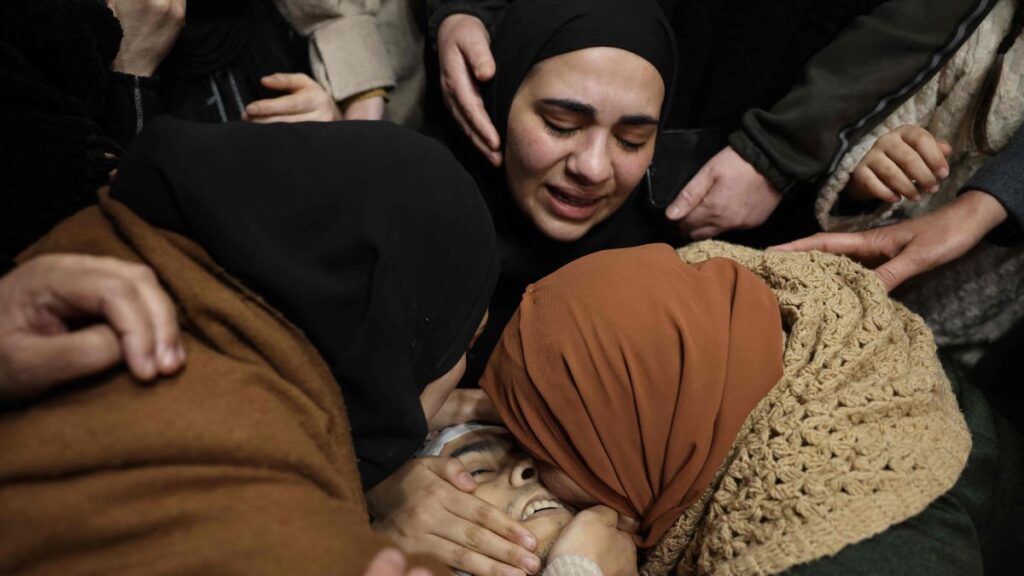 Relatives of Palestinian Mohammed Hadoush mourn over his body during his funeral in the occupied West Bank, Palestine, Feb. 3, 2025. (AFP Photo)