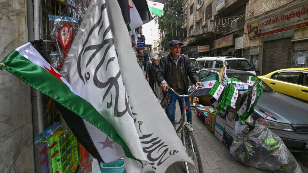 A man ride a bicycle on a sidewalk in Damascus, Syria, Jan. 26, 2025. (AFP Photo)