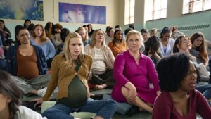 This image released by Netflix shows Brianne Howey (L) and Amy Schumer in a scene from "Kinda Pregnant." (AP Photo)