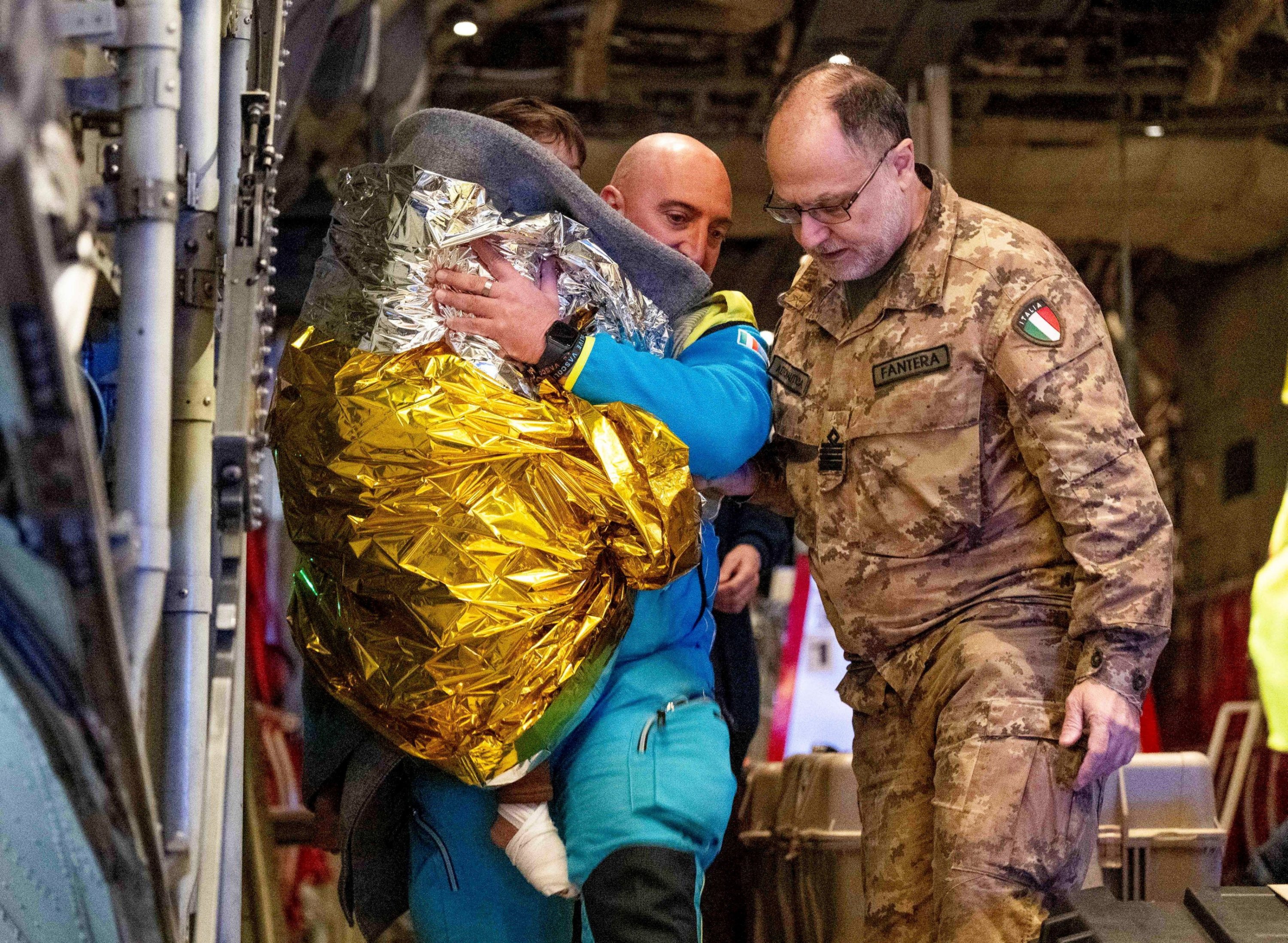 368605 Rescuers and authorities carry children from Gaza in need of care at Linate airport, Milan, Italy, Feb. 14, 2025. (EPA Photo)