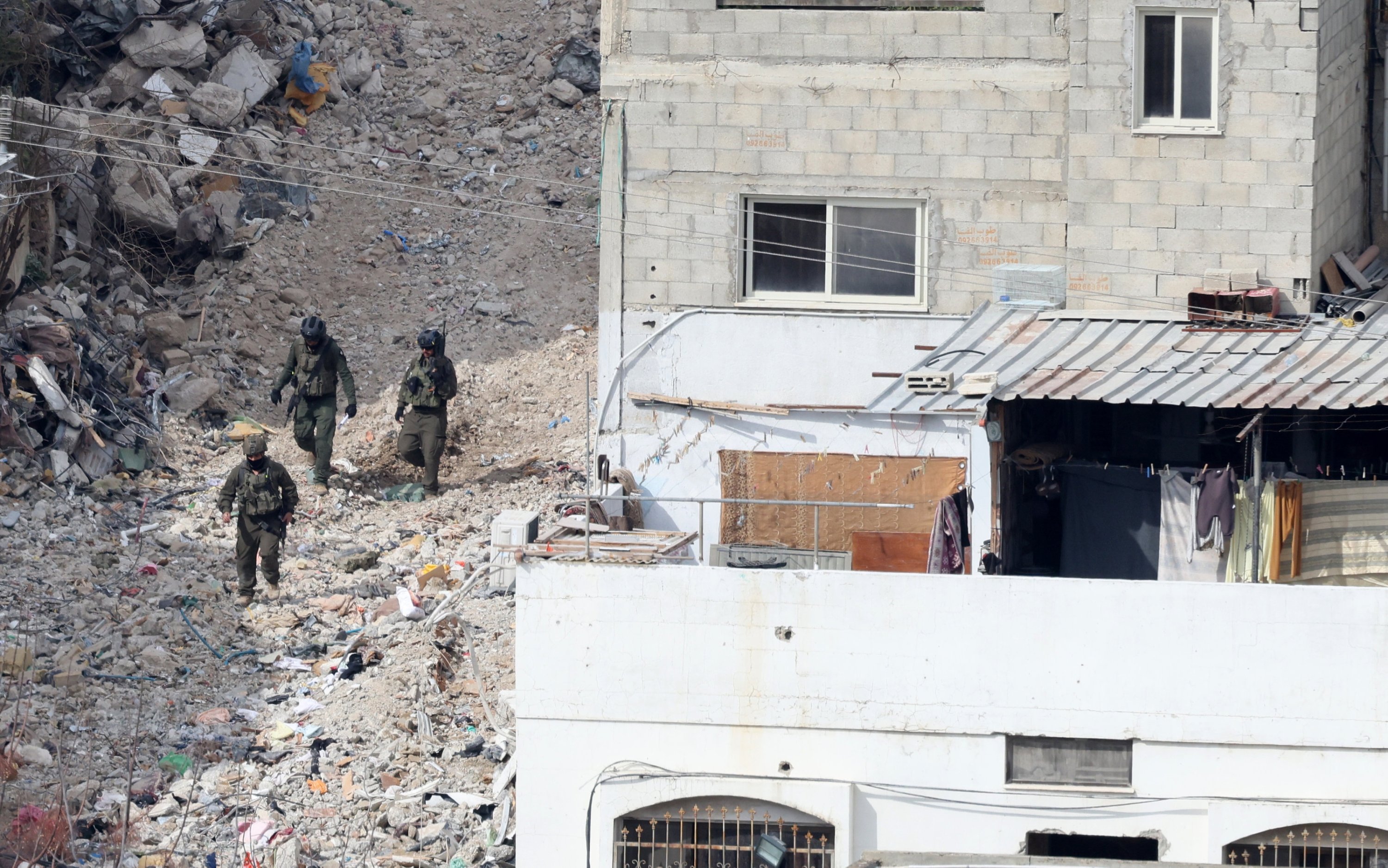 369395 Israeli soldiers among damaged buildings at Tulkarem refugee camp, in the occupied West Bank, Palestine, Feb. 19, 2025. (EPA Photo)