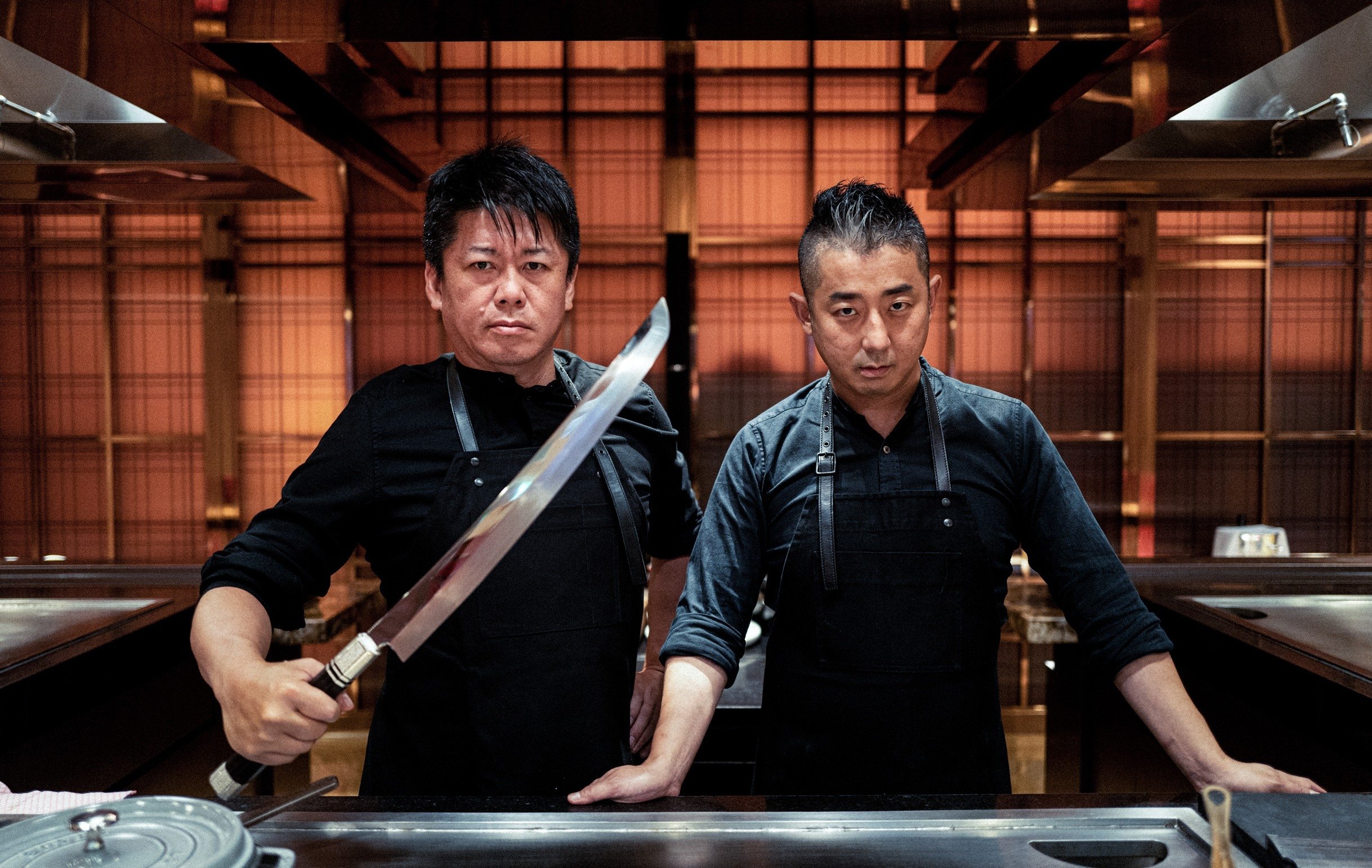 369693 Chef and wagyu expert Hisato Hamada (R) and entrepreneur Takafumi Horie (L) pose together, Tokyo, Japan. (Courtesy of İlker Topdemir)