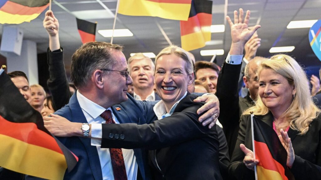 Co-leaders of Germany's far-right Alternative for Germany (AfD) party Alice Weidel (C) and Tino Chrupalla (L) hug during the electoral evening, Berlin, Germany, Feb. 23, 2025. (AFP Photo)