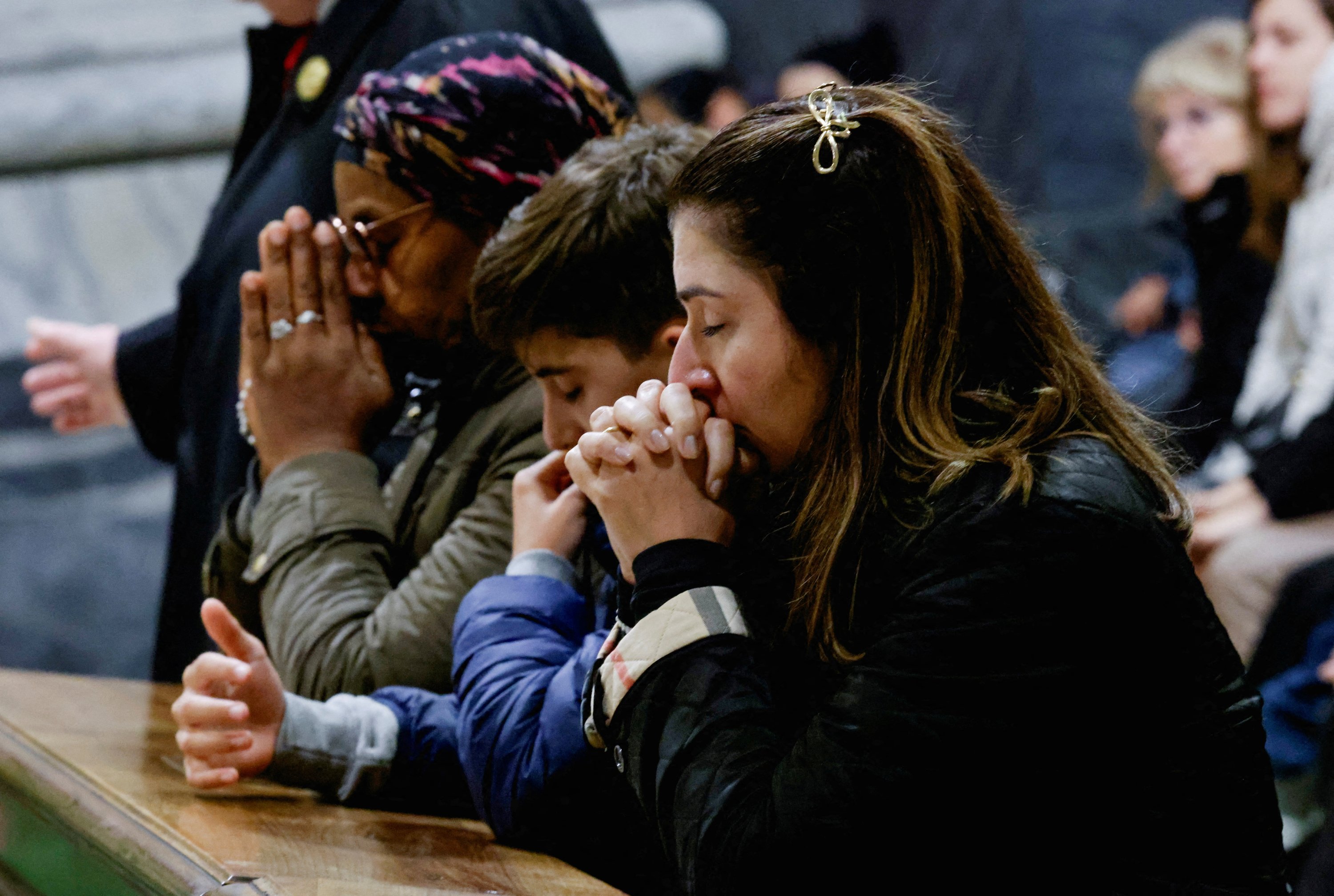 370352 People pray for Pope Francis, who is in critical condition battling double pneumonia, inside Archcathedral of Saint John in Lateran, Rome, Italy, Feb. 23, 2025. (Reuters Photo)