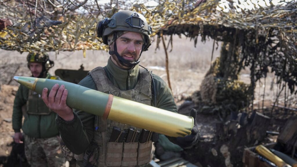 A Ukrainian serviceman carries a shell as he fires an OTO Melara howitzer toward Russian positions, near Pokrovsk in Donetsk region, Ukraine, March 3, 2025. (Reuters Photo)