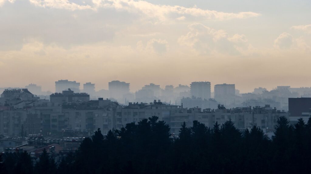 An aerial view of buildings enveloped by smog, Antalya, Türkiye, March 5, 2025. (DHA Photo)