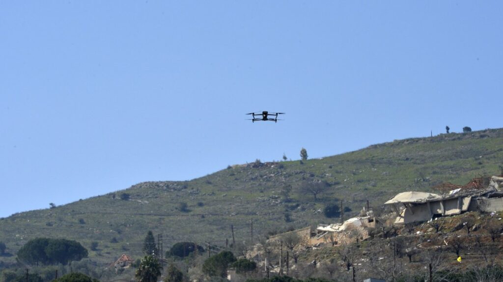 An Israeli drone flies during a mass funeral of Hezbollah fighters who died during fights with the Israeli army before the cease-fire, in Kfar Kila village, southern Lebanon, March 9, 2025. (EPA Photo)