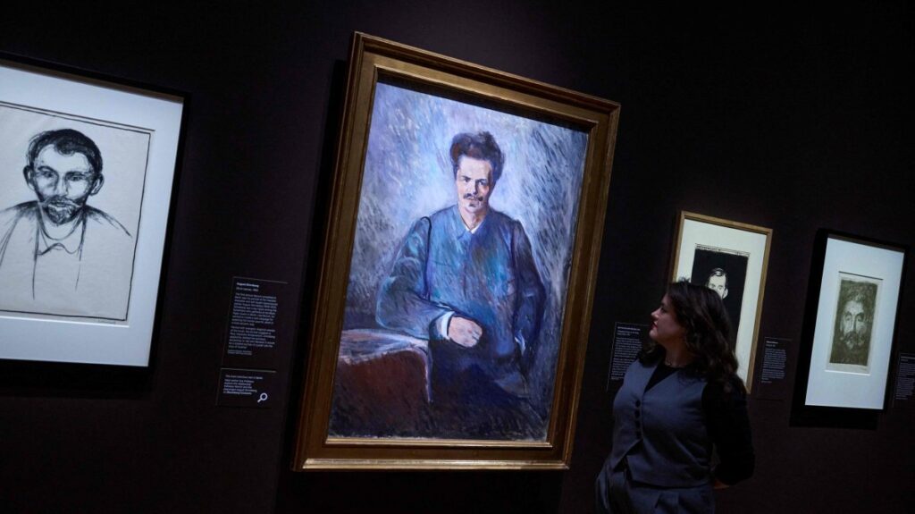 A gallerist poses with "August Stindberg" (1892) by Norwegian painter Edvard Munch during the press photocall for the exhibition "Edvard Munch Portraits" at the National Portrait Gallery, London, U.K., March 12, 2025. (AFP Photo)