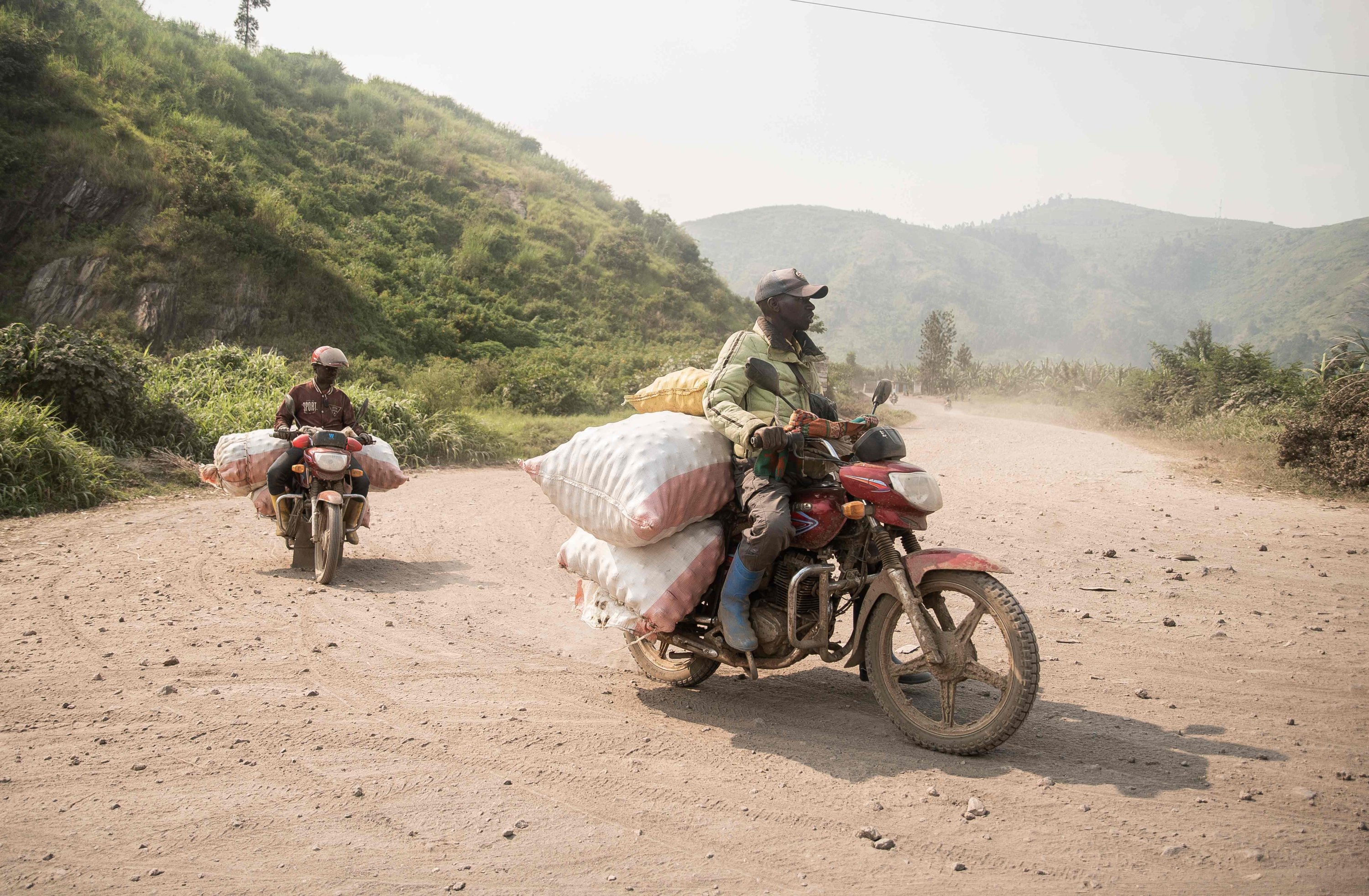 373060 Motorcycles coming from Masisi Ngungu transport sacks of potatoes to the central market of Sake, DRC, Feb. 27, 2025. (AFP Photo)