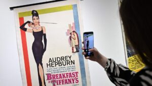 A poster for the film 'Breakfast at Tiffany's' starring actor Audrey Hepburn, is pictured during a press preview ahead of the Cinema on Paper: The Dwight M. Cleveland Collection Movie Posters Auction, at Heritage Auctions, London, U.K., Feb. 27, 2025. (AFP Photo)