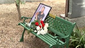 A portrait of late British singer Liam Payne and flowers sit on a bench unveiled by One Direction fans at the British Cemetery, Buenos Aires, Argentina, March 16, 2025. (Reuters Photo)