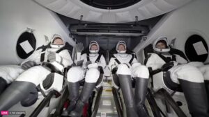 This image taken from a video released by SpaceX shows, from left, NASA's Butch Wilmore, Russia’s Alexander Gorbunov, NASA’s Nick Hague and NASA's Suni Williams waiting to exit the SpaceX capsule after splashing down, March 18, 2025. (AP Photo)