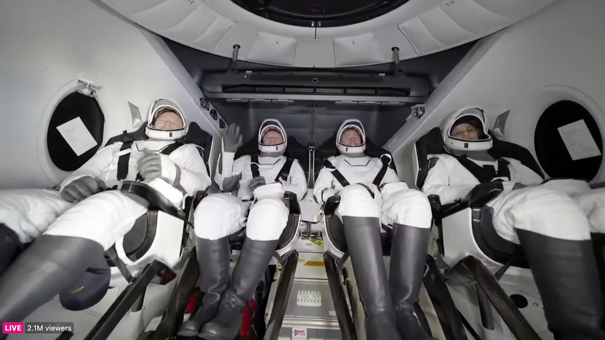 This image taken from a video released by SpaceX shows, from left, NASA's Butch Wilmore, Russia’s Alexander Gorbunov, NASA’s Nick Hague and NASA's Suni Williams waiting to exit the SpaceX capsule after splashing down, March 18, 2025. (AP Photo)