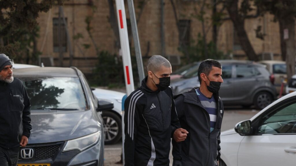 Palestinian Ahmed Manasra (C), released earlier in the day from an Israeli jail, leaves an Israeli security office accompanied by his father in Jerusalem, April 10, 2025. (AFP Photo)