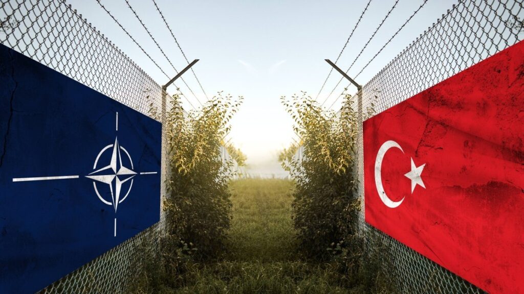 NATO (L) and Turkish flags hang on a fence at a border, Bavaria, Germany, Nov. 11, 2024. (Reuters Photo)