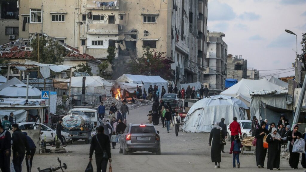 Internally displaced Palestinians walk on the streets of Gaza City, April 14, 2025. (EPA Photo)