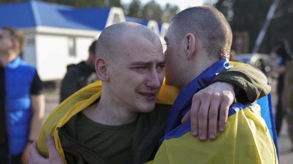 Ukrainian POWs react following a prisoner swap at an undisclosed location in Ukraine, April 19, 2025. (EPA Photo)