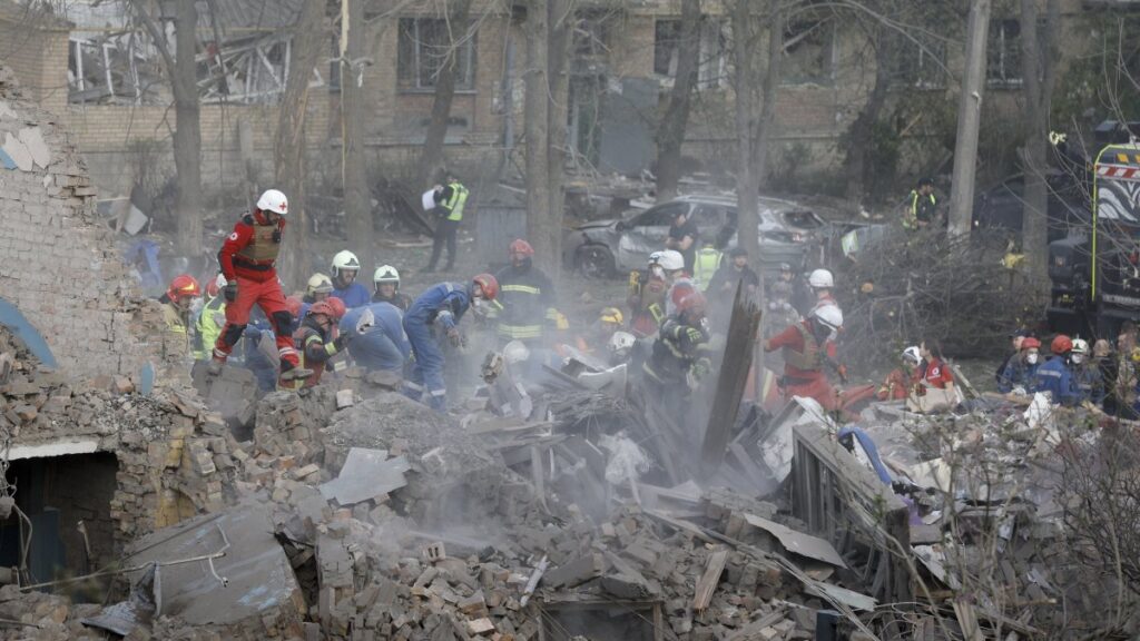 Rescuers work at the site of a residential building hit by a rocket in Kyiv, Ukraine, April 24, 2025. (EPA Photo)