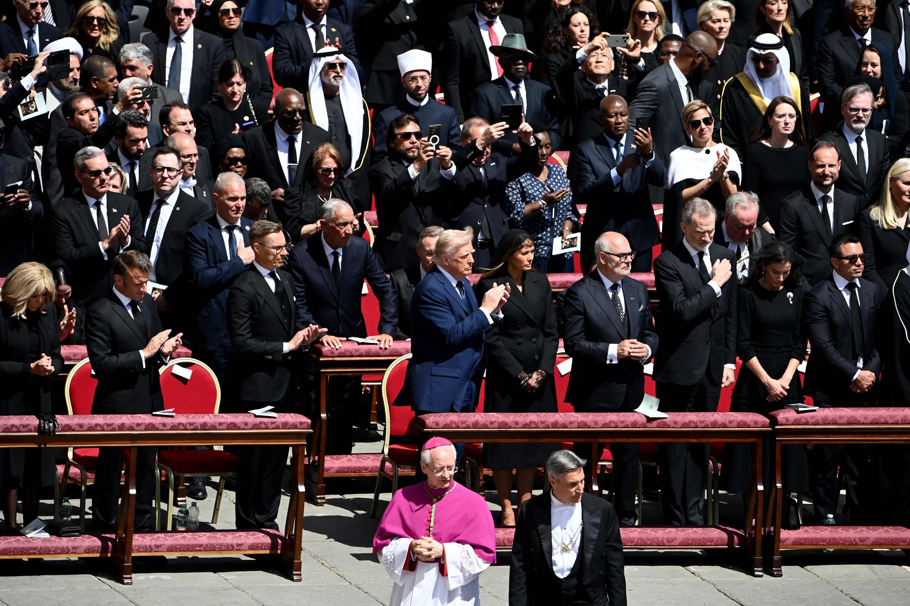 379491 (1st row- L to R) French President's wife Brigitte Macron, France's President Emmanuel Macron, Finland's President Alexander Stubb, U.S. President Donald Trump and his wife Melania Trump, Estonia's President Alar Karis, Spain's King Felipe VI, (2nd row) applaud as they attend late Pope Francis' funeral ceremony at St Peter's Square in The Vatican, April 26, 2025. (AFP Photo)