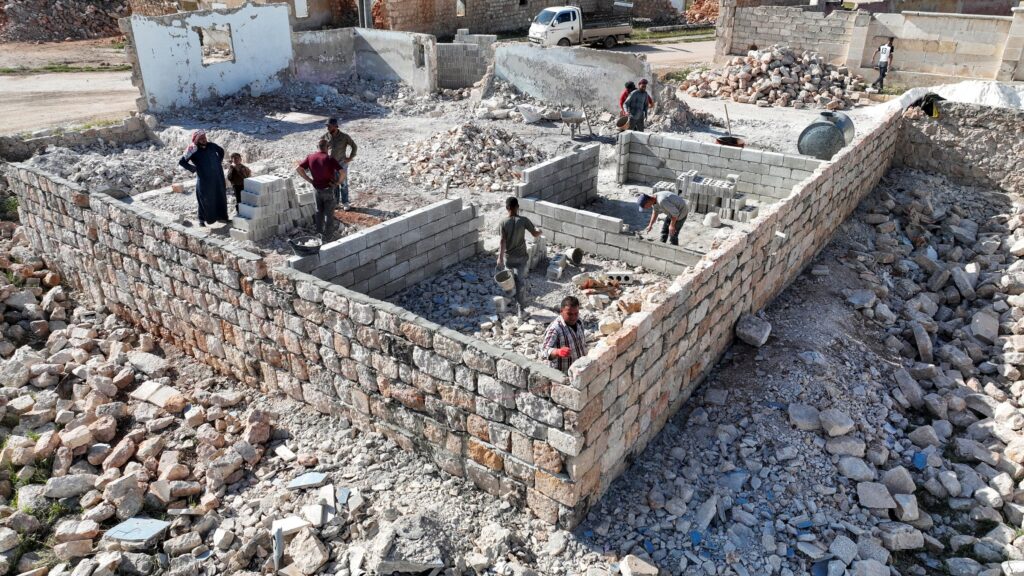 A drone view shows people rebuilding their house in Aleppo, Syria, April 19, 2025. (Reuters Photo)