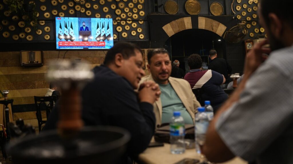 Syrians watch a speech by Syrian President Ahmad al-Sharaa at a cafe in central Damascus, Syria, May 14, 2025. (EPA Photo)