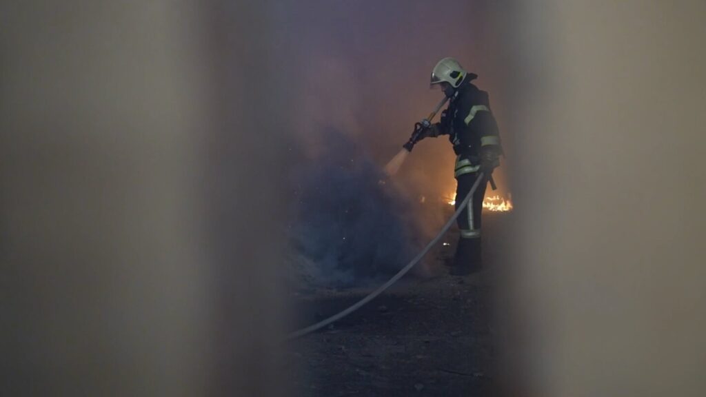 A Ukrainian emergency worker puts out a fire at the site of a Russian missile strike in Sumy, Ukraine, May 21, 2025. (AA Photo)