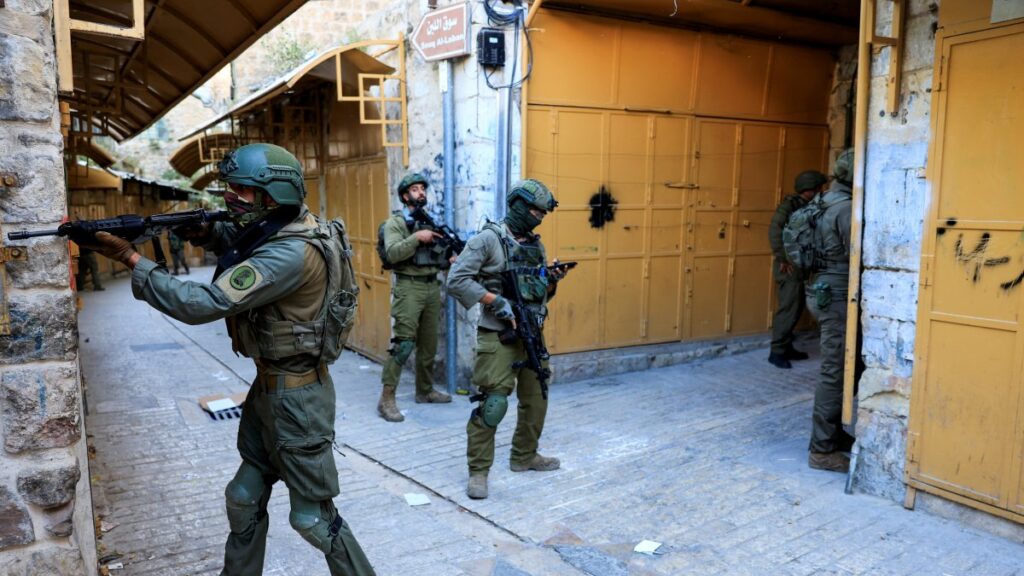 Israeli troops stand guard during a weekly settlers' tour in Hebron, West Bank, Palestine, May 24, 2025. (Reuters Photo)