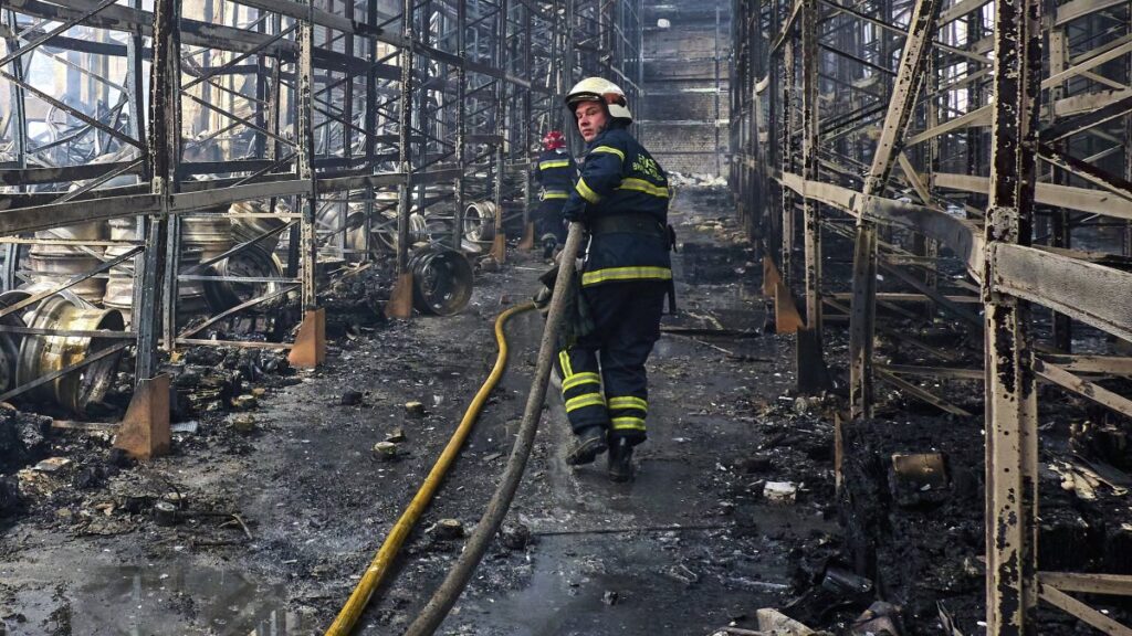 Ukrainian firefighters and rescuers work at the site of a damaged storage facility of a private factory following an overnight attack in Vasyshcheve, near Kharkiv, Ukraine, May 26, 2025. (EPA Photo)