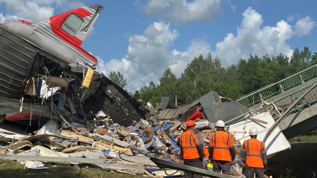 Emergency workers at the scene, after a road bridge collapsed onto railway tracks due to an explosion in the Bryansk region, Russia, June 1, 2025. (Reuters Photo)