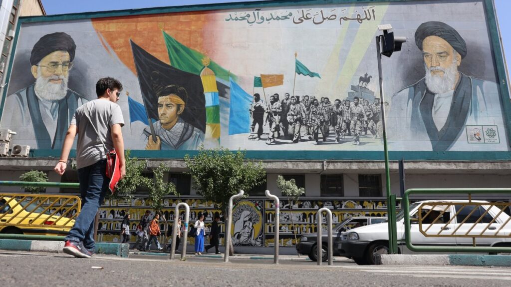 Iranians walk past portraits of Ayatollah Ali Khamenei (L) and late Iranian supreme leader Ayatollah Ruhollah Khomeini in Tehran, Iran, June 1, 2025. (EPA Photo)