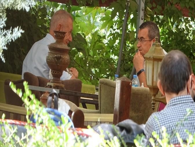 385185 In this picture released by Turkish authorities, Metin Gürcan (L) is seen allegedly speaking with a foreign mission representative at an undisclosed location. (IHA Photo)