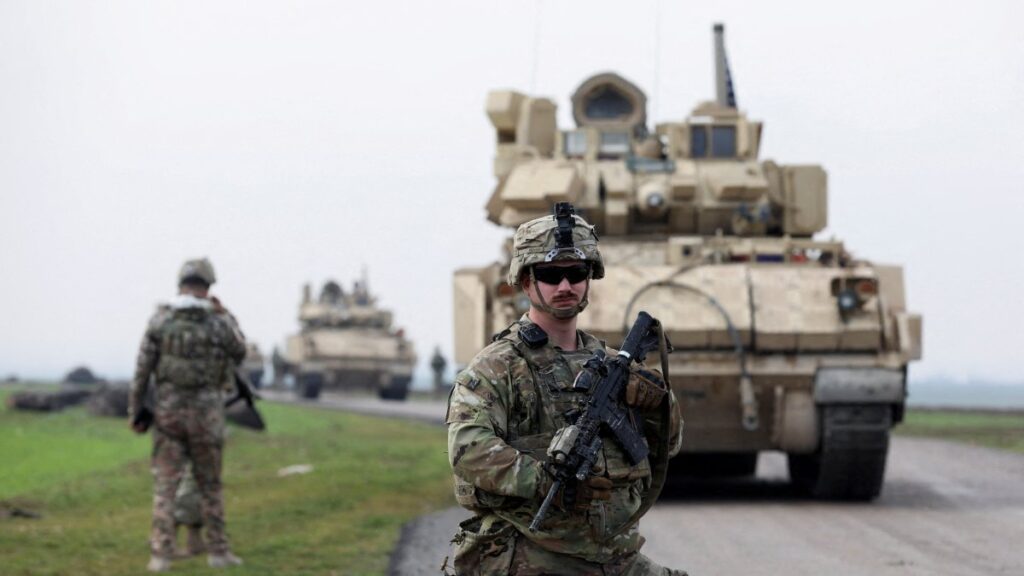A soldier from the U.S.-led coalition stands guard during a patrol in the countryside of Qamishli, northeastern Syria, Feb. 8, 2024. (Reuters Photo)
