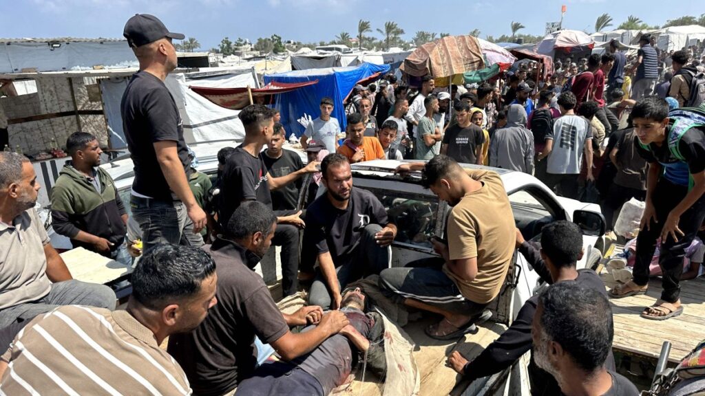 Palestinians evacuate a wounded man amid long queues for receiving humanitarian aid in the southern Gaza city of Rafah, June 15, 2025. (AFP Photo)