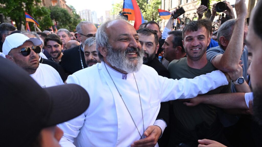Demonstrators surround protest leader Archbishop Bagrat Galstanyan during a march against land transfer to Azerbaijan, in Yerevan, Armenia, May 9, 2024. (AFP Photo)