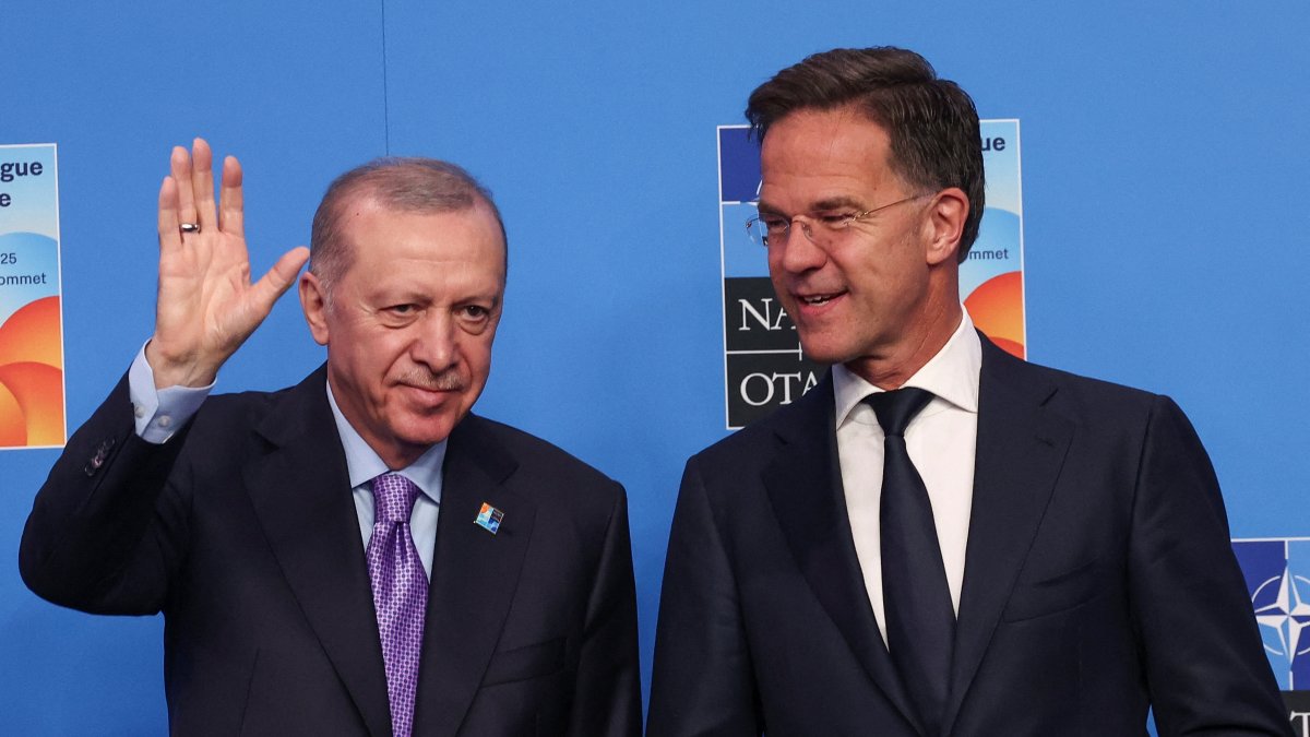 NATO Secretary-General Mark Rutte and President Recep Tayyip Erdoğan react as they pose for a photo during a NATO summit, The Hague, Netherlands, June 25, 2025. (Reuters Photo)