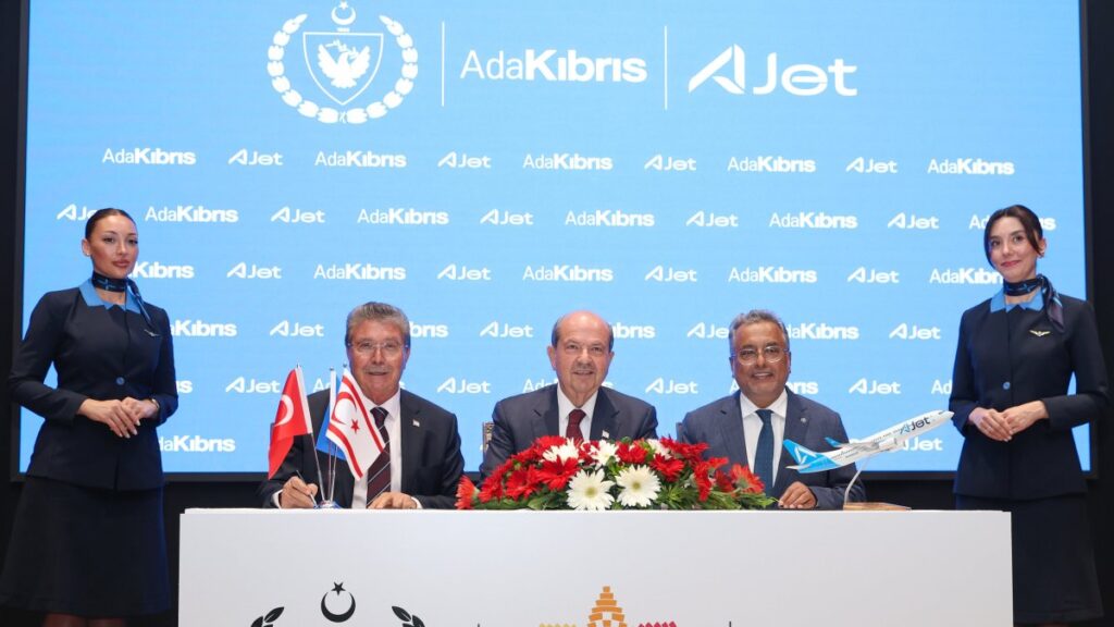 TRNC President Ersin Tatar (C) and Turkish Airlines Board of Directors and Executive Committee Chair Ahmet Bolat (R) alongside TRNC Prime Minister Ünal Üstel during the ceremony of the signing of the protocol to facilitate air transportation to TRNC, Lefkoşa (Nicosia), TRNC, July 7, 2025. (AA Photo)