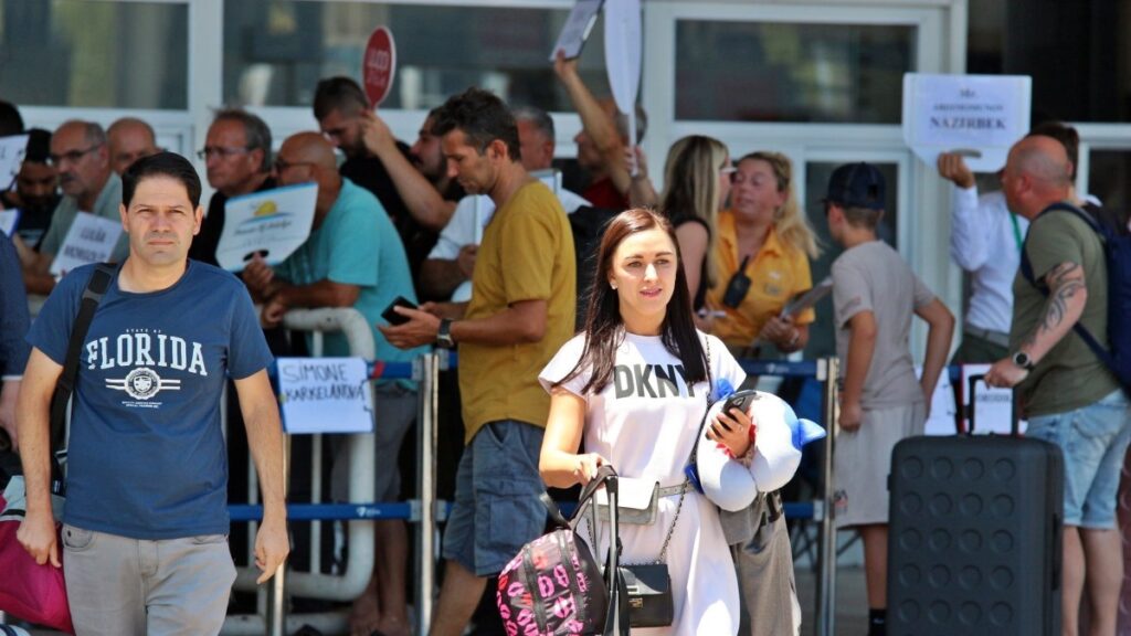 Tourists are seen exiting the airport in Antalya, southern Türkiye, July 13, 2025. (IHA Photo)