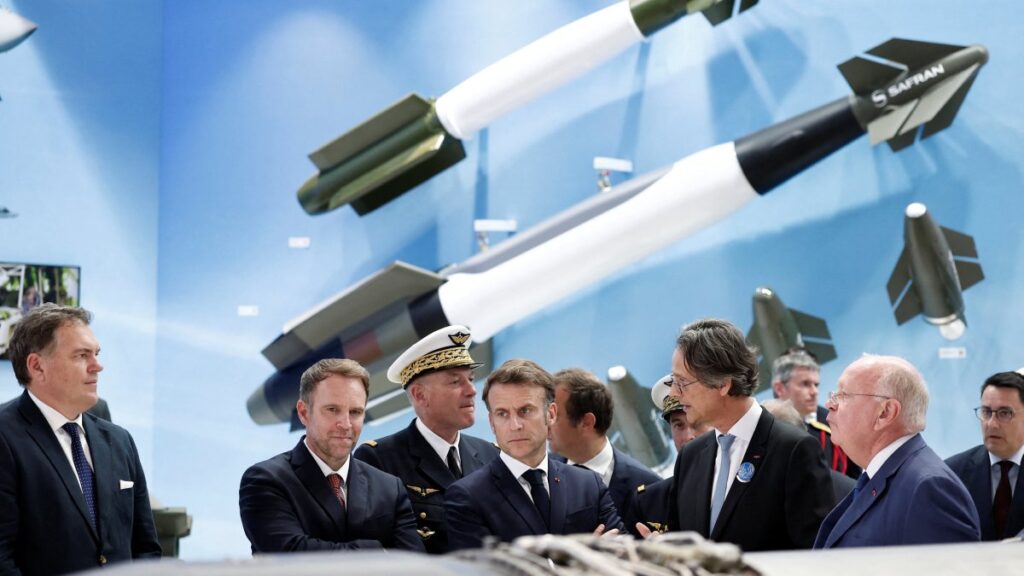 French President Emmanuel Macron (C) listens to CEO of Safran Olivier Andries (2nd R) as French Minister for Transport Philippe Tabarot (L), Minister for Industry and Energy Marc Ferracci (2nd L), and Ross McInnes (R), Chairperson of the Board of Safran, look on at the stand of aerospace and defense company Safran during a visit at the 55th International Paris Air Show at Le Bourget Airport, Paris, France, June 20, 2025. (EPA Photo)
